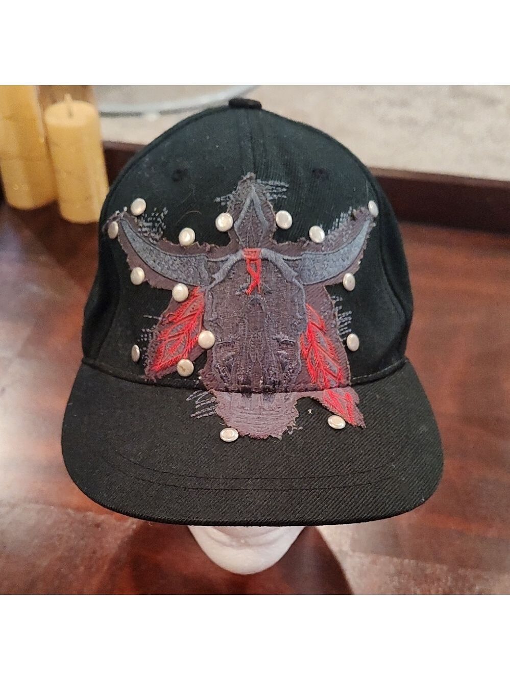 Men's Black Cap with Red Feather Embroidered Accent